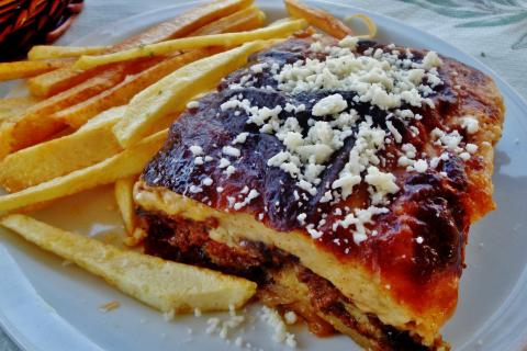 Moussaka is a Greek dish.. The French for "Moussaka is a Greek dish." is "La moussaka est un plat grec.".