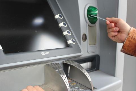 ATM (automatic teller machine). The French for "ATM (automatic teller machine)" is "un distributeur automatique".
