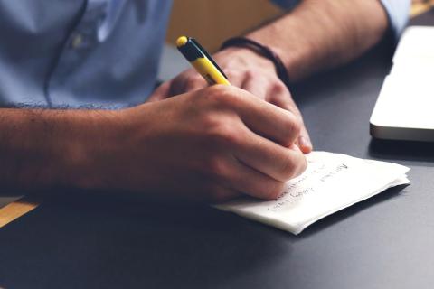 Wrote. The French for "wrote" is "a écrit".