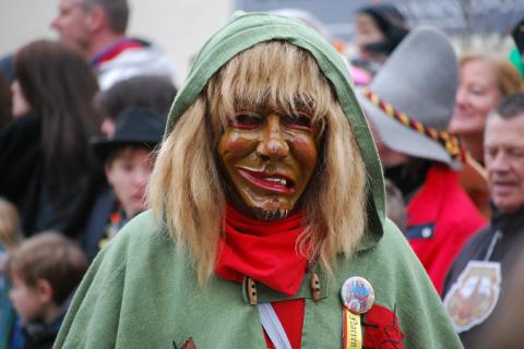 Disguise. The Greek for "disguise" is "μεταμφίεση".