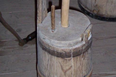 Butter churn. The Greek for "butter churn" is "ανακάτεμα βουτύρου".