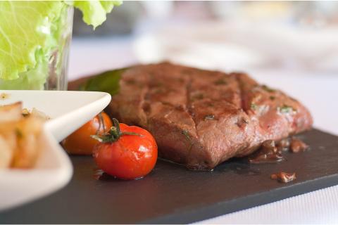 The steak. The Greek for "the steak" is "η μπριζόλα".