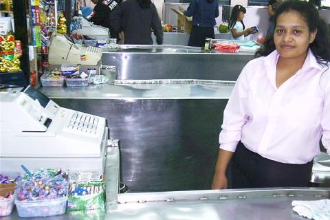 Cashier. The Greek for "cashier" is "ταμίας".