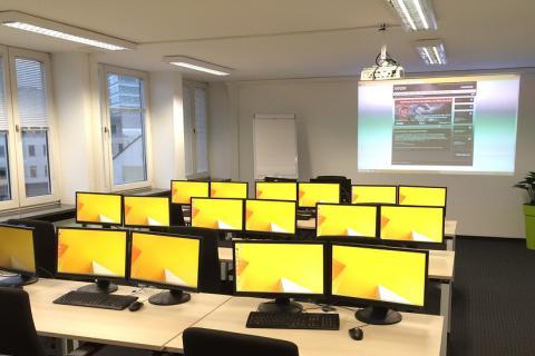 Classroom. The Spanish for "classroom" is "aula".