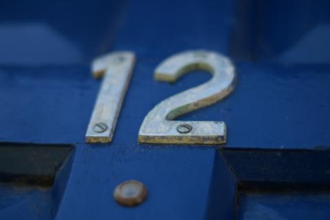 12 (twelve). The Thai for "12 (twelve)" is "สิบสอง".