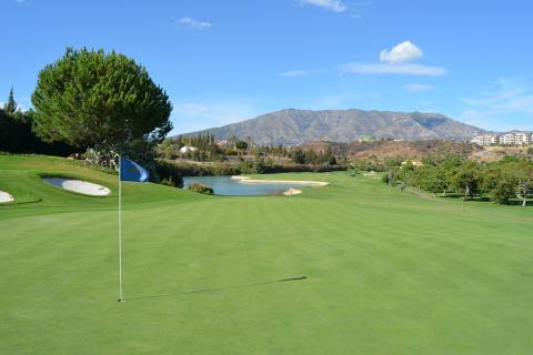 Golf course. The Thai for "golf course" is "สนามกอล์ฟ".