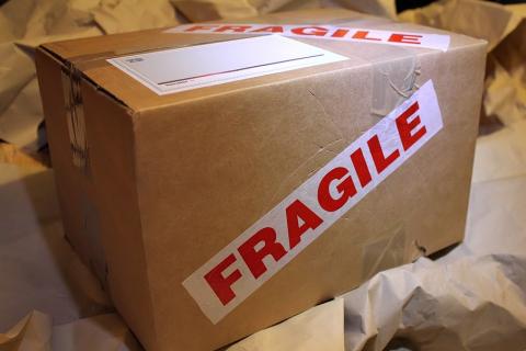 Parcel. The Thai for "parcel" is "พัสดุ".