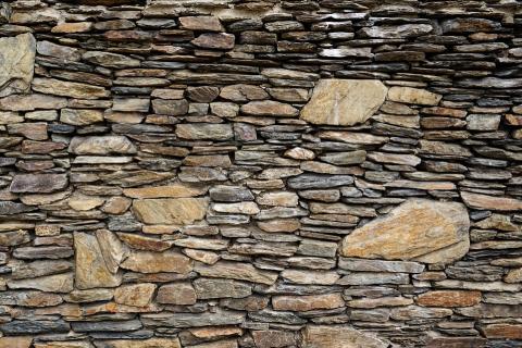 A stone wall. The Thai for "a stone wall" is "กำแพงหิน". A stone wall. The Thai for "a stone wall" is "กำแพงหิน".