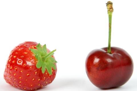 A cherry and a strawberry. The Thai for "a cherry and a strawberry" is "เชอร์รี่และสตรอเบอรี่".