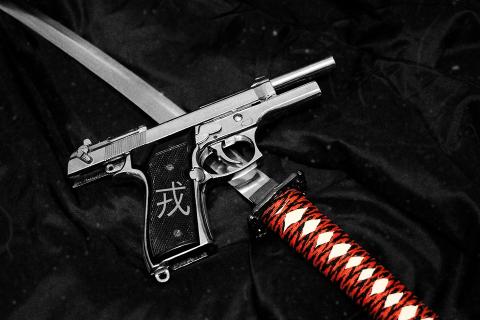 A sword and a gun. The Thai for "a sword and a gun" is "ดาบและปืน". A sword and a gun. The Thai for "a sword and a gun" is "ดาบและปืน".
