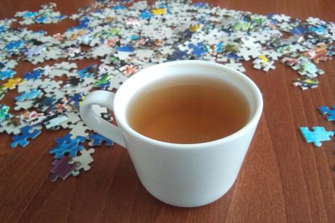 A cup of tea and a jigsaw puzzle. The Thai for "a cup of tea and a jigsaw puzzle" is "ชาหนึ่งถ้วยและจิ๊กซอว์".