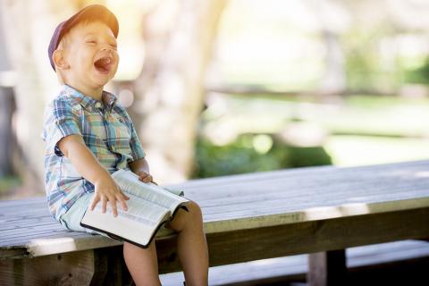 A boy and a book. The Thai for "a boy and a book" is "เด็กผู้ชายและหนังสือ".