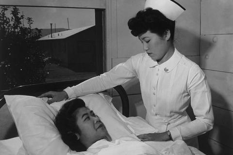 A nurse and a patient. The Thai for "a nurse and a patient" is "พยาบาลและผู้ป่วย".