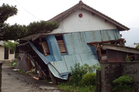 A damaged house. The Thai for "a damaged house" is "บ้านพัง".