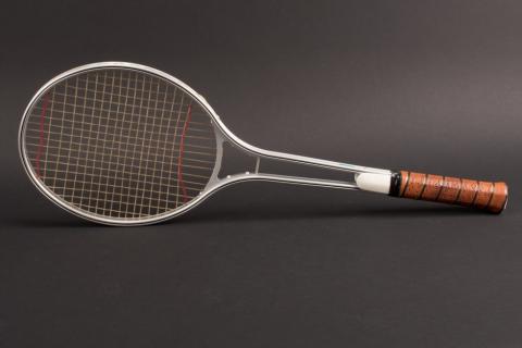 A tennis racket. The Thai for "a tennis racket" is "ไม้ตีเทนนิส".