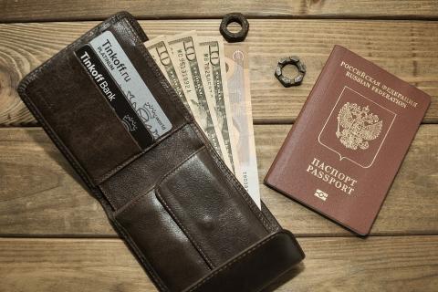 A wallet and a passport. The Thai for "a wallet and a passport" is "กระเป๋าตังค์และพาสปอร์ต". A wallet and a passport. The Thai for "a wallet and a passport" is "กระเป๋าตังค์และพาสปอร์ต".
