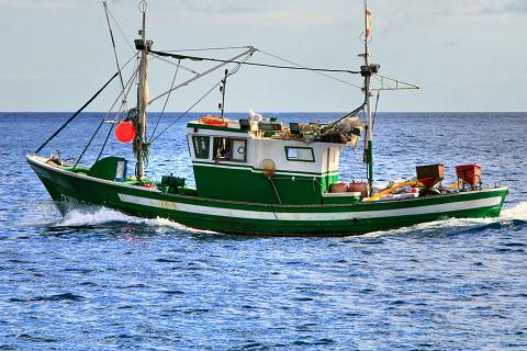 Fishing boat. The Thai for "fishing boat" is "เรือประมง".