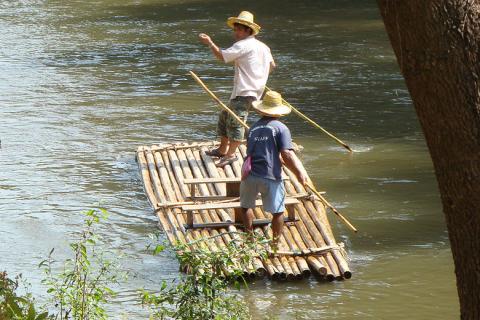 Two men on a raft. The Thai for "two men on a raft" is "ผู้ชายสองคนบนแพ".