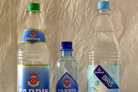 Three bottles of mineral water. The Thai for "three bottles of mineral water" is "น้ำแร่สามขวด".