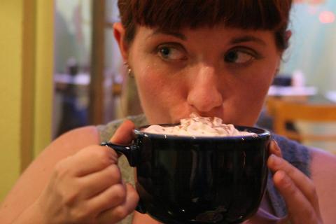 A woman is drinking hot cocoa. The Thai for "a woman is drinking hot cocoa" is "ผู้หญิงกำลังดื่มโกโก้ร้อน". A woman is drinking hot cocoa. The Thai for "a woman is drinking hot cocoa" is "ผู้หญิงกำลังดื่มโกโก้ร้อน".