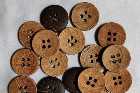 Coconut shell buttons. The Thai for "coconut shell buttons" is "กระดุมกะลา".