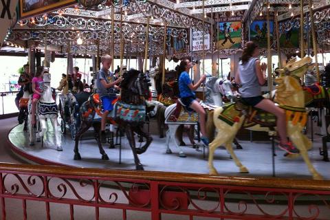 Children on a carousel. The Thai for "children on a carousel" is "เด็กๆบนม้าหมุน".