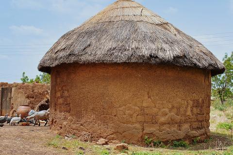 A mud hut. The Thai for "a mud hut" is "บ้านดิน".