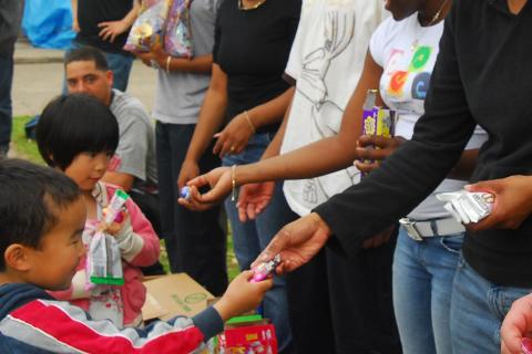 To hand out; to give out. The Thai for "to hand out; to give out" is "แจก".