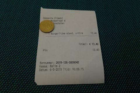 A coin on a bill. The Thai for "a coin on a bill" is "เหรียญบนใบเสร็จ".