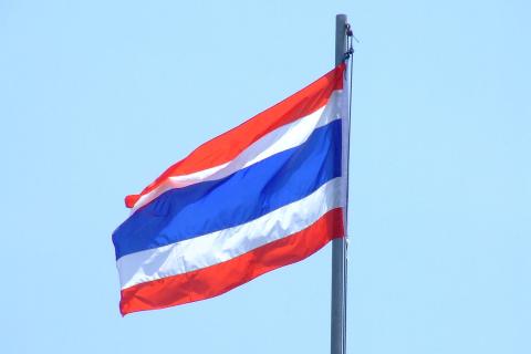 A Thai flag at the top of a flagpole. The Thai for "a Thai flag at the top of a flagpole" is "ธงชาติไทยบนยอดเสา". A Thai flag at the top of a flagpole. The Thai for "a Thai flag at the top of a flagpole" is "ธงชาติไทยบนยอดเสา".