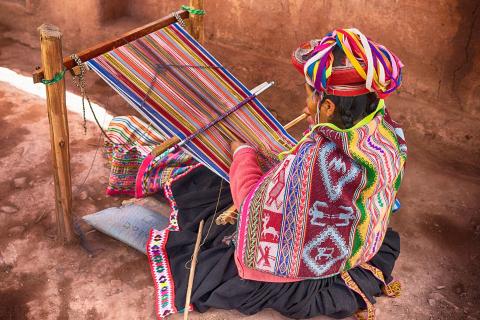 To weave. The Thai for "to weave" is "ทอผ้า".