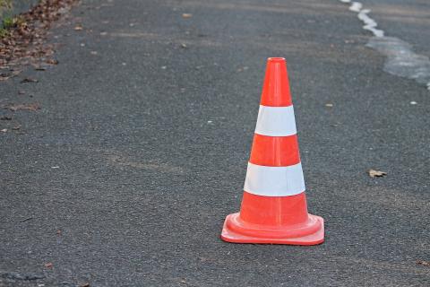 A traffic cone. The Thai for "a traffic cone" is "กรวยจราจร".