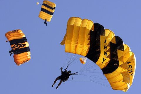 To parachute. The Thai for "to parachute" is "กระโดดร่ม".