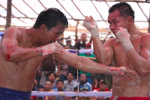 To fight; to combat. The Thai for "to fight; to combat" is "ต่อสู้".