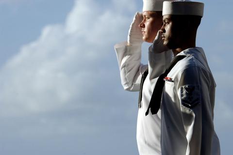 To salute. The Thai for "to salute" is "ทำความเคารพ".