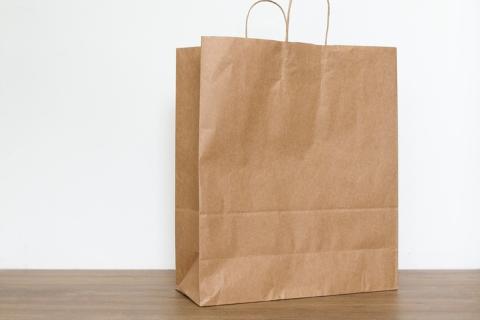 A paper bag. The Thai for "a paper bag" is "ถุงกระดาษ".