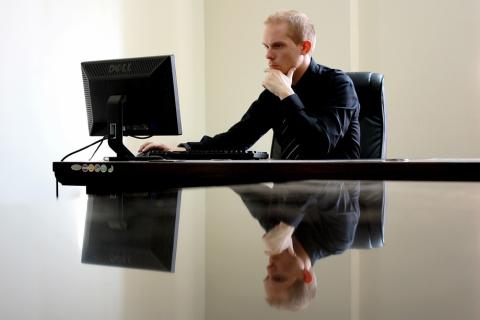 Businessman. The Ukrainian for "businessman" is "бізнесмен".