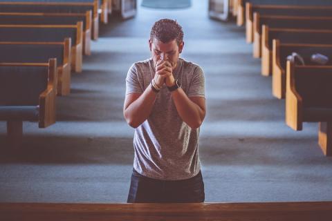 To pray. The Ukrainian for "to pray" is "молитися".