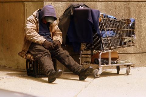 Homeless. The Ukrainian for "homeless" is "бездомний".